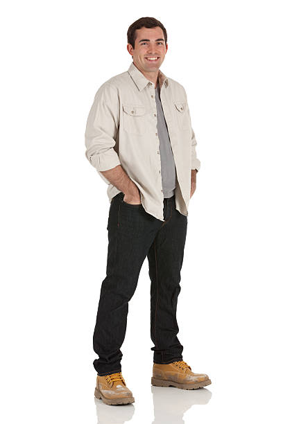 istock Happy man standing with his hands in pockets 185317257