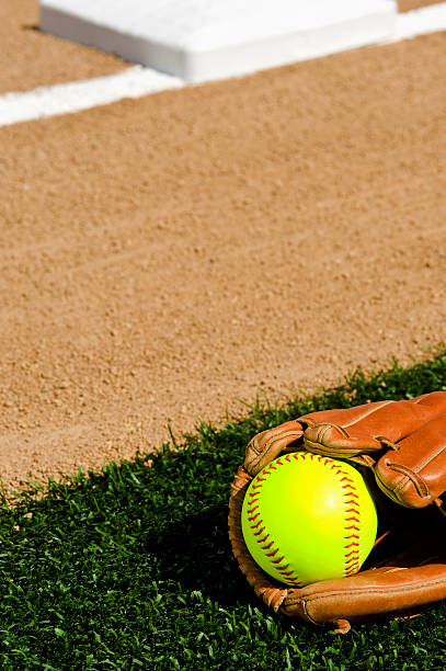 istock Softball in glove - First base infield 185317951