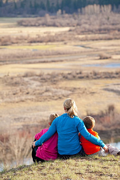 istock Family Admiring A Beautiful Valley View 185318416
