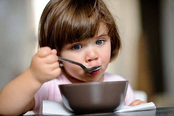 istock girl eating 185318830