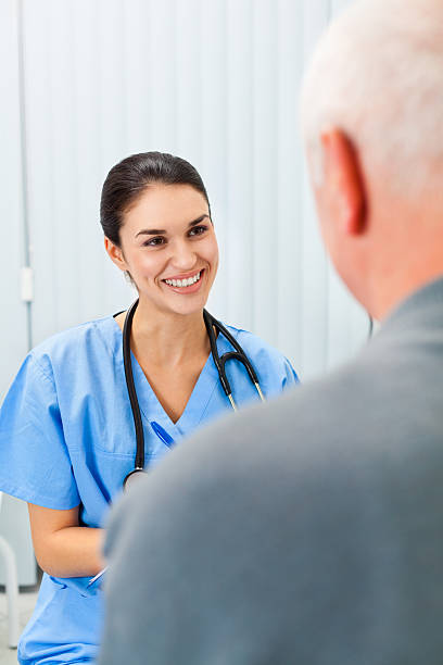 istock Doctor talking with senior patient 185318874