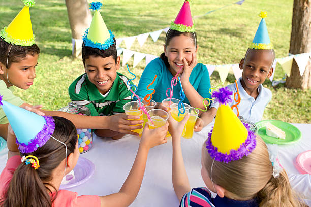 istock Multi-ethnic group of playful children at a party 185318930