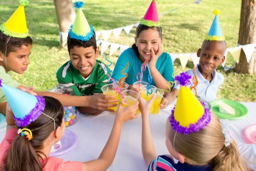 Multi-ethnic group of playful children at a party