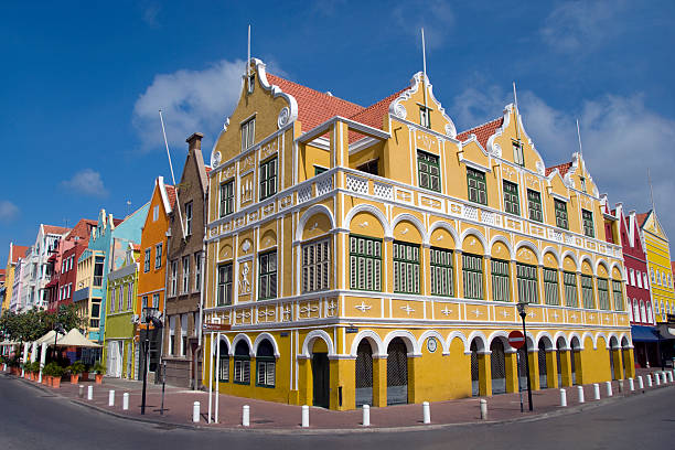 The Penha building in Willemstad Curacao "The bright colored buildings in the centre of Willemstad, Curacao." willemstad stock pictures, royalty-free photos & images