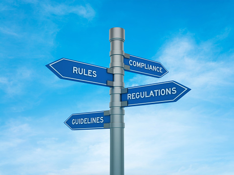 Directional Sign with Compliance Rules Regulations Guidelines Words - Sky Background - 3D Rendering