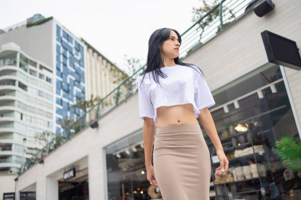Young woman walking in the square