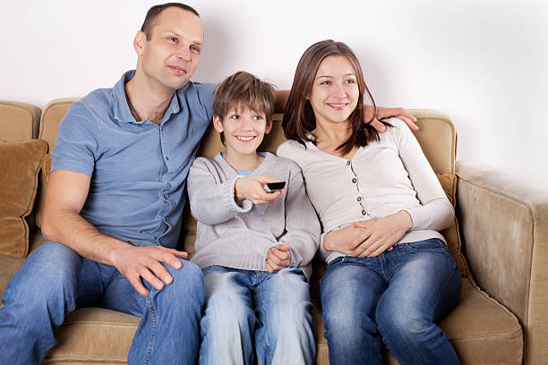 istock Happy family watching TV 185319933