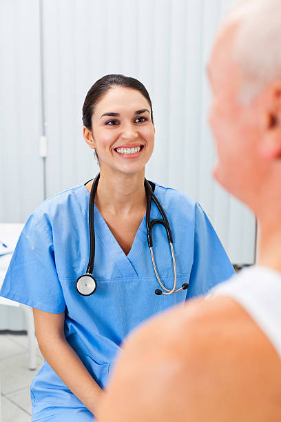 istock Nurse talking with senior patient 185320634