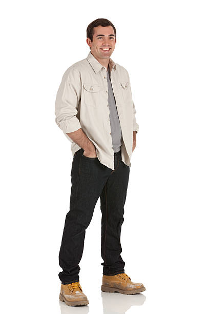 istock Happy man standing with hands in pockets 185320676