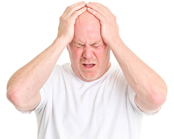 istock Frustrated Man Holds Head 185321271
