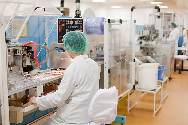 Women working at the pharmaceutical factory stock photo