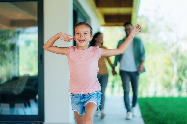 istock Happy little girl running 1853226795