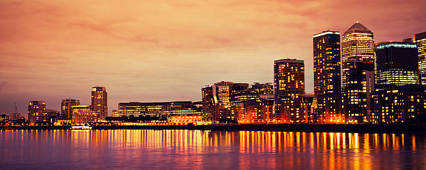 istock Sunset at Canary Wharf on Thames River in London 185323242