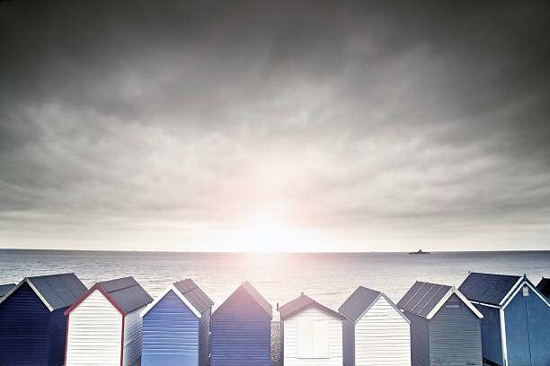 beach huts at sunset