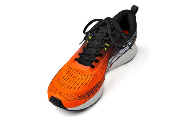 istock Orange sports sneaker isolated on a white background. Front view close up 1853233563