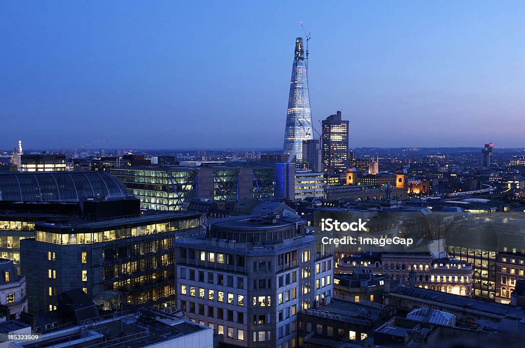 The Shard and Offices at Dusk London's Shard and office lights at dusk Architecture Stock Photo