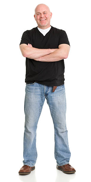 portrait de heureux homme mature debout - t shirt white men jeans photos et images de collection