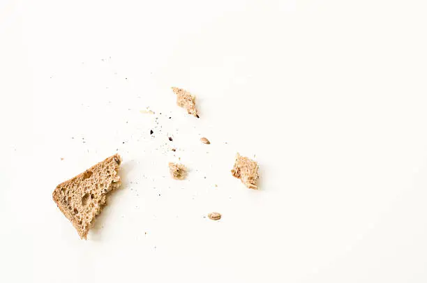 Bread crumbs on a white table.