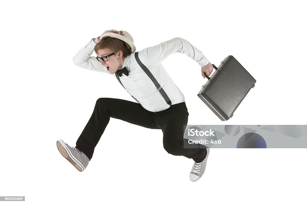 Uomo che corre con valigetta - Foto stock royalty-free di Correre