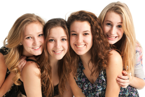Subject: A group of young teen girls posing and having fun on white background.