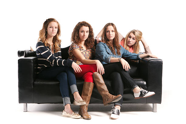 istock Young Women Models with Black Sofa on White Background Hz 185325254