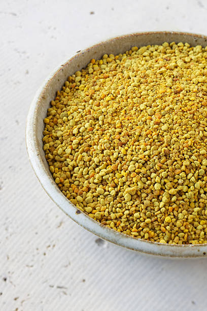 istock Natural bee pollen in ceramic bowl on concrete 185325442