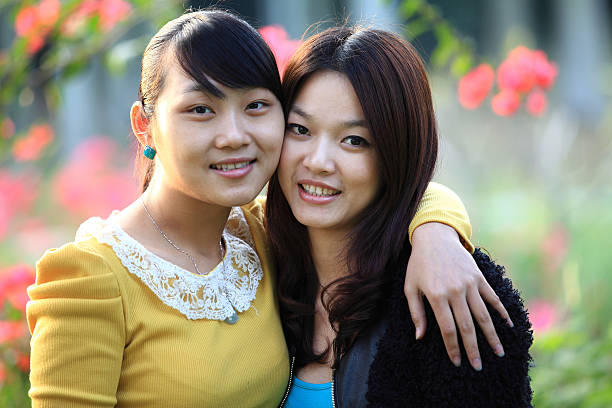 istock Two female friends smiling togetherness 185325510