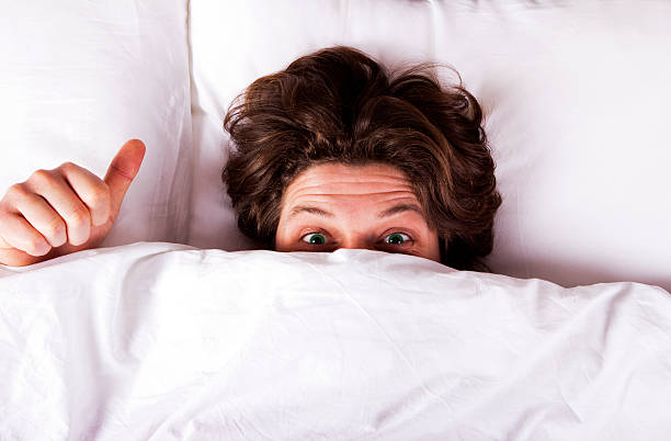 istock Funny Boy showing thumbs up on the bed 185325606
