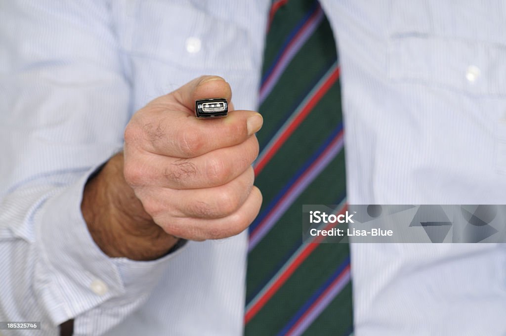 Businessman Showing USB Flash Drive Businessman with pendrive Adult Stock Photo