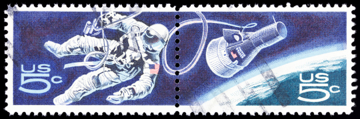 Cancelled Postage Stamp of a Space Walking Astronaut.