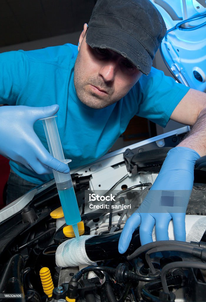 Car first aid Man repairing the car Pit Stop Stock Photo
