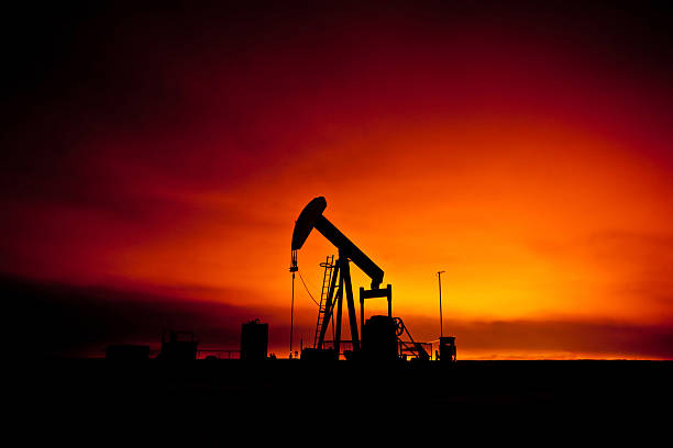 pumpjack на закате - oil pump oil industry alberta equipment стоковые фото и изображения