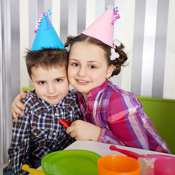 istock Cheerful brother and sister at birthday party. 185326708