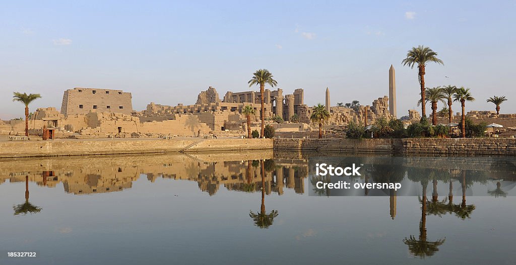 Ancient Egyptian reflections "The Ancient Egyptian temples of Karnak reflected at dawnLuxor, Egypt" Ancient Egyptian Culture Stock Photo