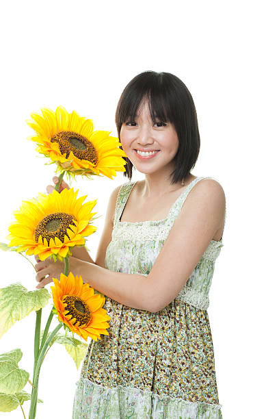 istock Young woman holding sunflower 185327168
