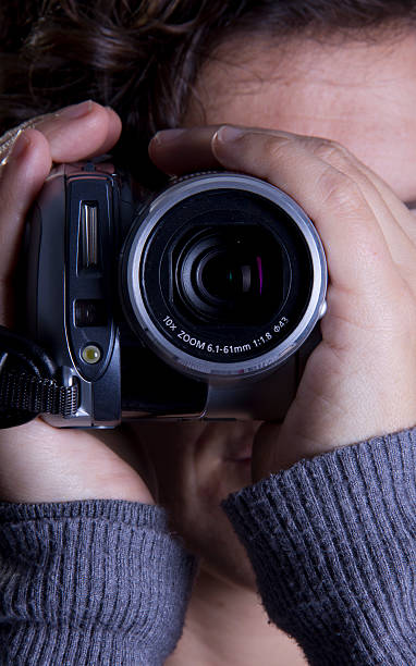 istock Woman with handy cam 185327590