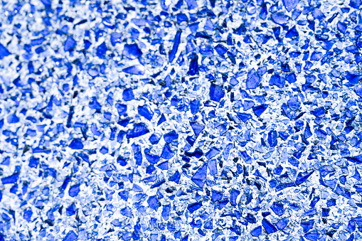 Abstract background. Blue broken glass. Full frame