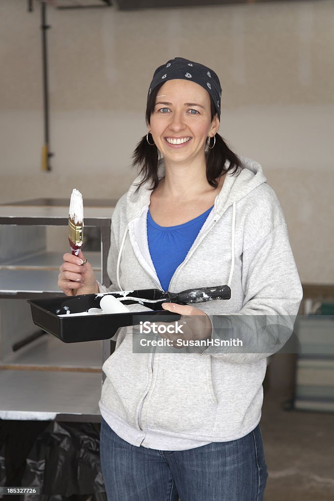 Smiling Woman Painting Shelves "Beauitiful young woman painting shelves, with white paint and roller.For more Do It Yourself Images please click on lightbox below..." 30-39 Years Stock Photo