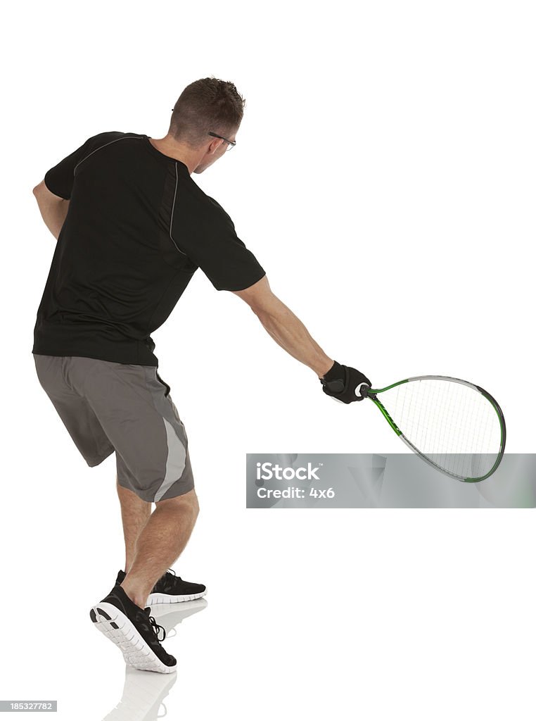 Hombre jugando al racquetball - Foto de stock de Squash libre de derechos