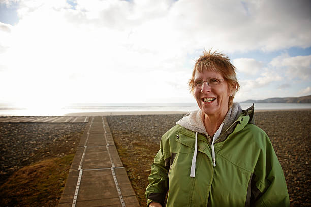 istock Mature woman at the beach 185328174