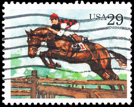 Eight cent Canadian postage stamp from 1975 commemorating 100 years of the Calgary Stampede Rodeo.