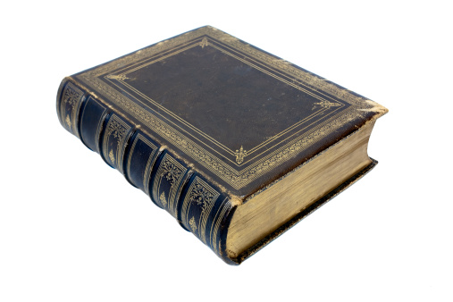 Old Antique Book on a white background with spine showing