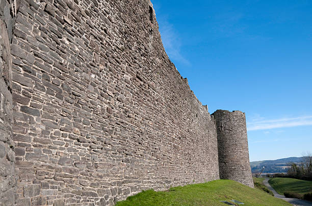 Castle Wall Remains of a medieval castle wall and turret conwy castle stock pictures, royalty-free photos & images
