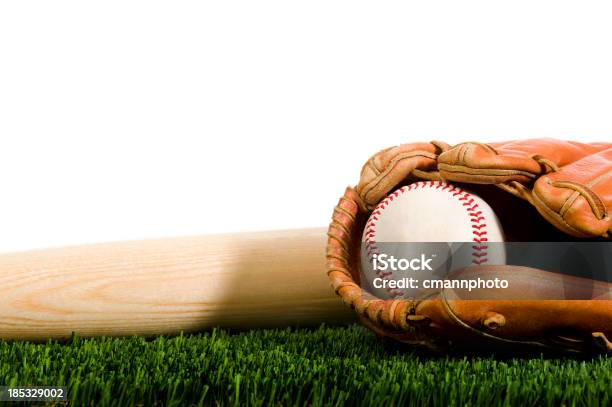 Baseball Glove And Bat In Grass With White Background Stock Photo - Download Image Now