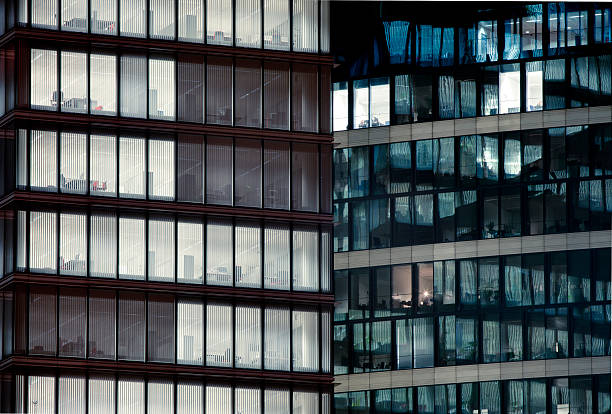 istock Late night overtime in a modern office building. 185329115