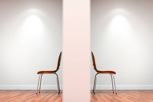 Two chairs split by wall Two chairs in a gallery space split by a wall and facing back to back.(Computer Generated Rendering) mediation stock pictures, royalty-free photos & images