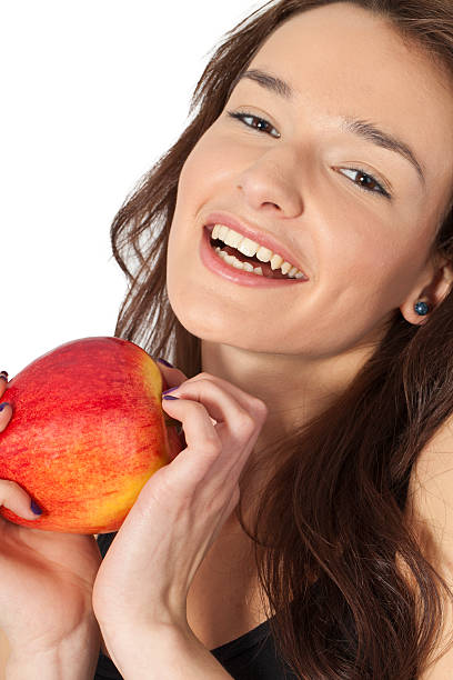 istock happy smiling woman with fresh apple 185329360