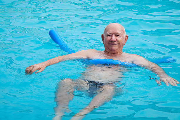 istock Active Senior Man in Swimming Pool 185329559