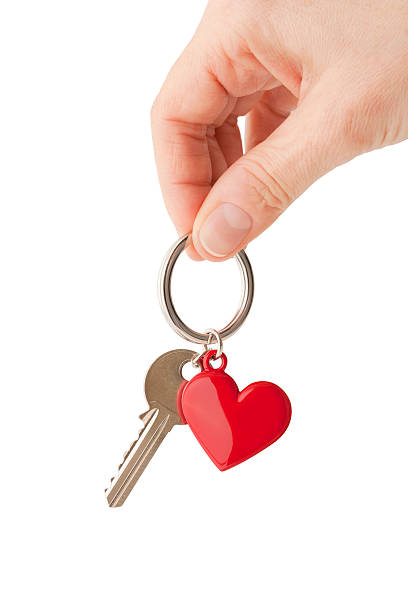 Heart shaped key ring  http://www.primarypicture.com/iStock/IS_HeartShape.jpg keyring charm stock pictures, royalty-free photos & images