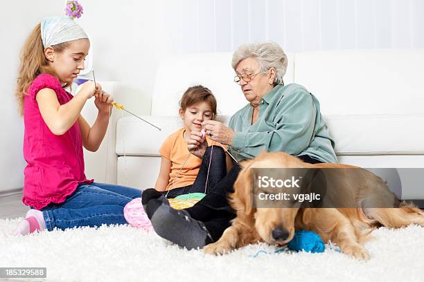 Grandmother And Grandchildren Knitting At Home Stock Photo - Download Image Now - 4-5 Years, 70-79 Years, 8-9 Years